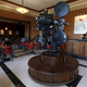 An old film projector stands inside the coffee shop in the foyer of the Roma Cinema.